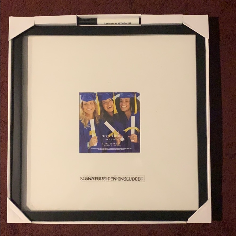 Black picture frame w/ white matte & signature pen
